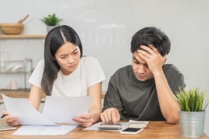 A couple look over their finances together.