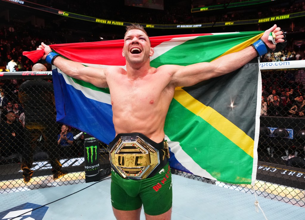 Dricus Du Plessis celebrates after his middleweight title win over Sean Strickland at UFC 297.