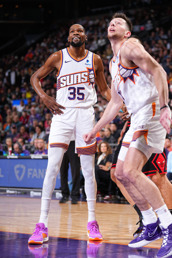 Kevin Durant #35 of the Phoenix Suns and Drew Eubanks #14 of the Phoenix Suns wait for a rebound during the game against the Chicago Bulls