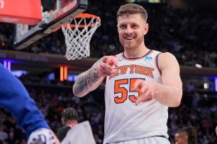 Isaiah Hartenstein, who had a career-high 20 rebounds, celebrates during the Knicks' 116-100 win over the Bulls.