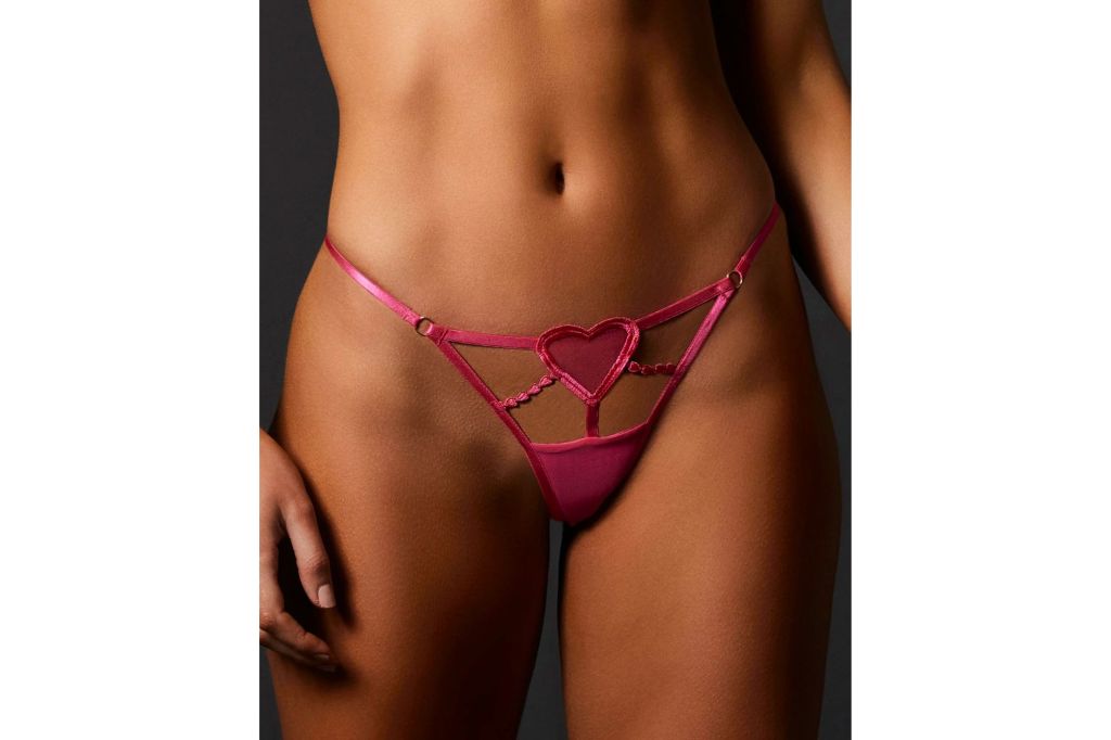 A modal in a pink thong with a heart in the center.