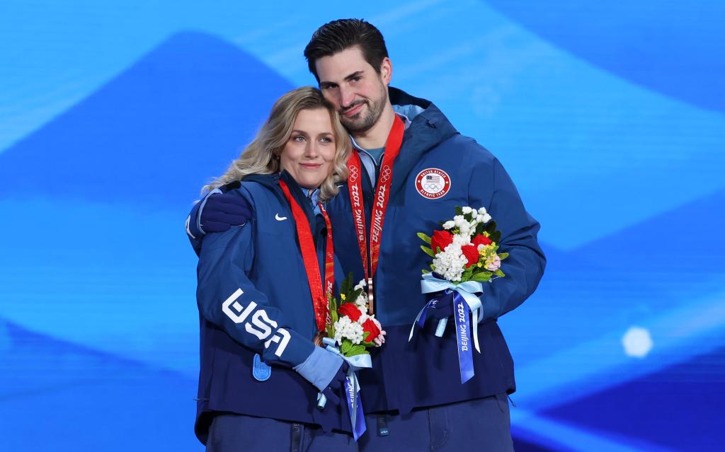 Bronze medalists Madison Hubbell and Zachary Donohue of USA celebrate during the Figure Skating Ice Dance Free Dance medal ceremony on Day 10 of the Beijing 2022 Winter Olympics 