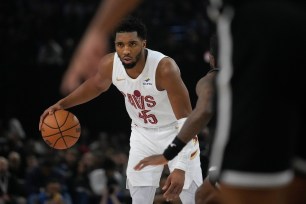 Cavaliers' Donovan Mitchell drives the ball during the NBA basketball game between Brooklyn Nets and Cleveland Cavaliers