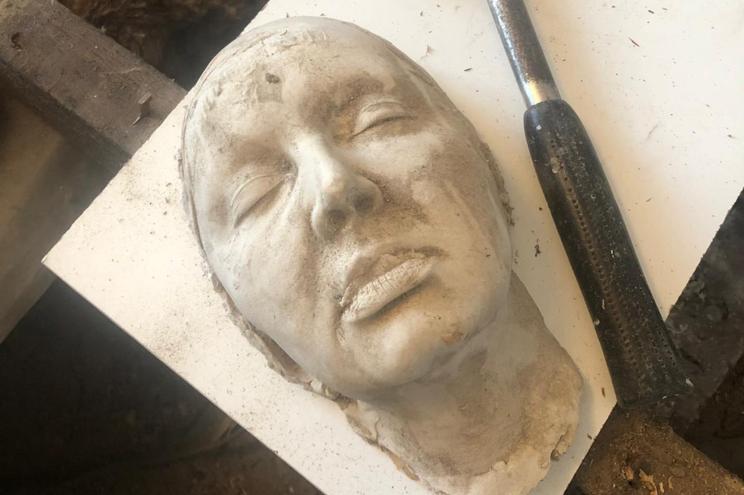 A woman said her husband found this "death mask" under her floors.