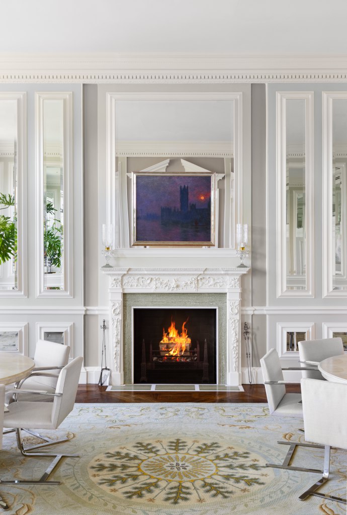 A handsome fireplace anchors this room.