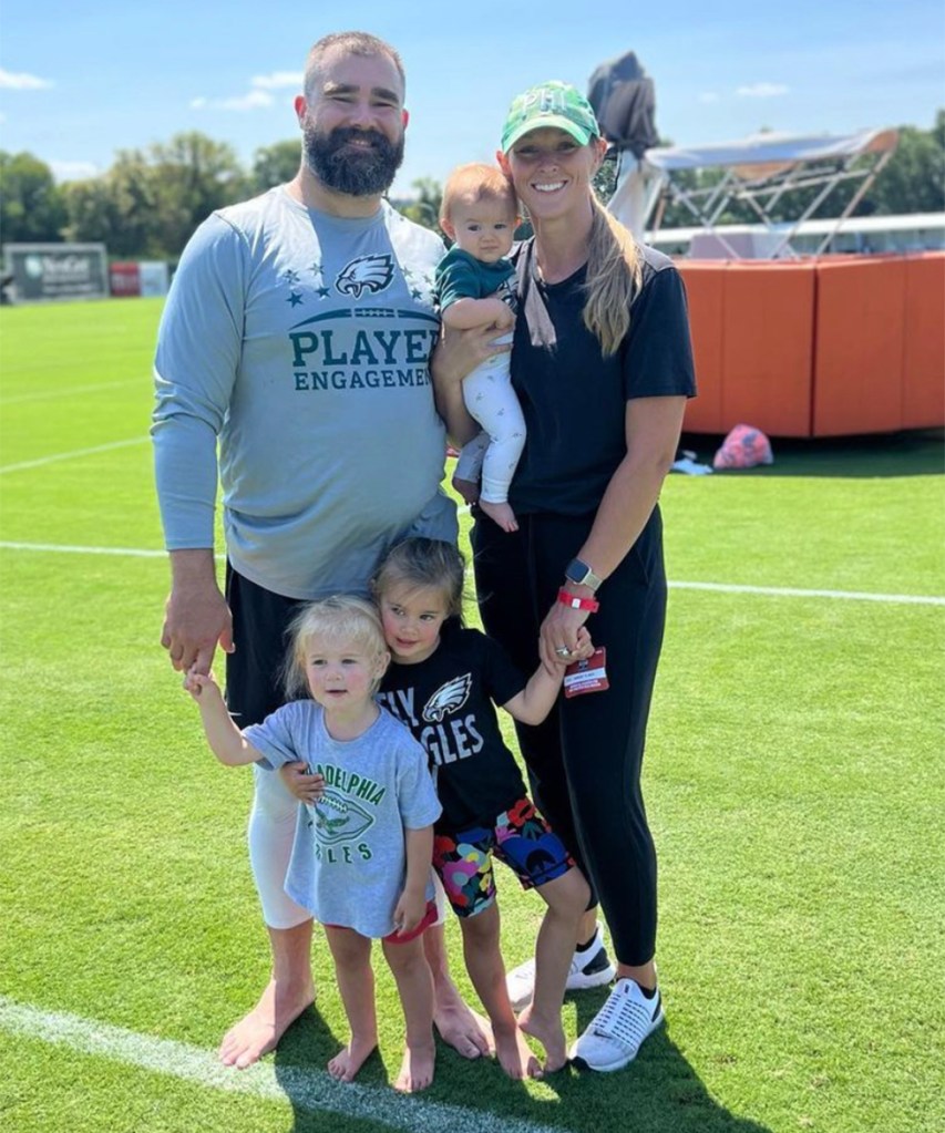 Jason Kelce and his wife Kylie Kelce with their three daughters at Eagles' training camp in 2023.