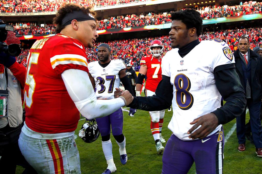 Quarterback Patrick Mahomes #15 of the Kansas City Chiefs shakes hands with quarterback Lamar Jackson #8 of the Baltimore Ravens after the Chiefs defeated the Ravens 27-24 in overtime to win the game at Arrowhead Stadium on December 09, 2018 in Kansas City, Missouri.