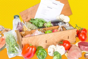 A box of fresh vegetables and fruits labeled as Best Meal Kits