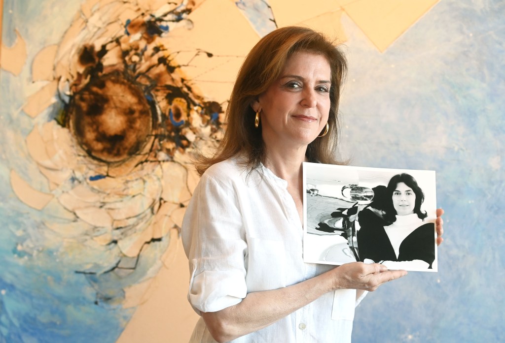 Melissa Kaish holding a photo of her late mother, acclaimed artist and sculptor Luise Kaish 
