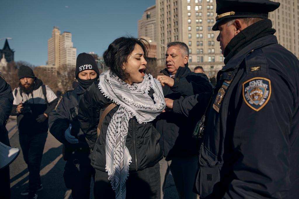 A protester is arrested by the cops during Monday's bridge-and-tunnel protests.