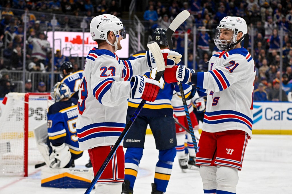 Adam Fox (l.) gave the Rangers a 1-0 lead in the first period.