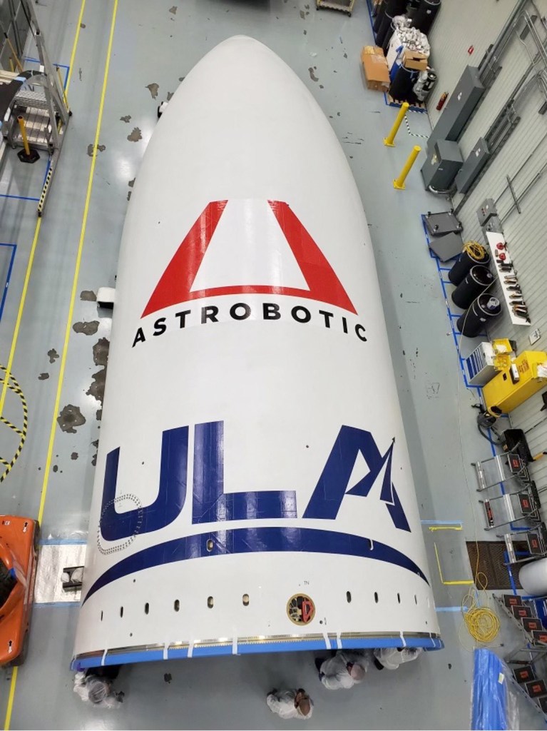 Tip of a rocket with Astrobotics and ULA logos on it
