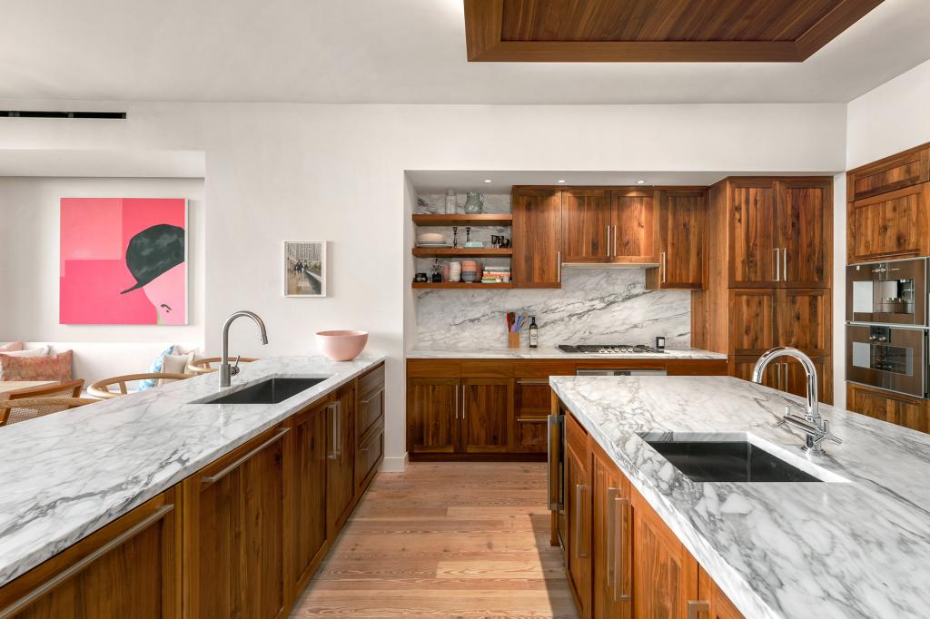 The triplex boasts a massive kitchen with two sinks.