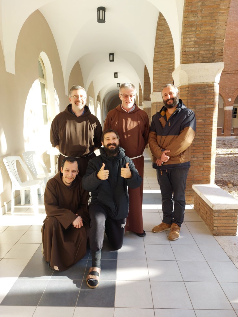 Shia LaBeouf gives two thumbs up while posing with friars.