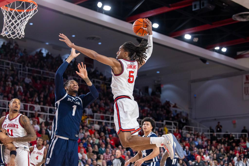 St. John's guard Daniss Jenkins (5) shoots over Butler forward Jalen Thomas