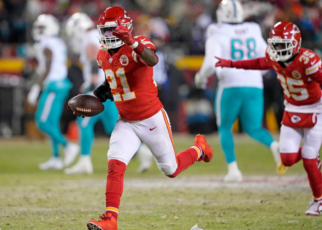 Kansas City Chiefs safety Mike Edwards (21) celebrates an interception in the 4th quarter against the Miami Dolphins in the wild card playoff game at Arrowhead Stadium in Kansas City, Missouri on Saturday, January 13, 2024.