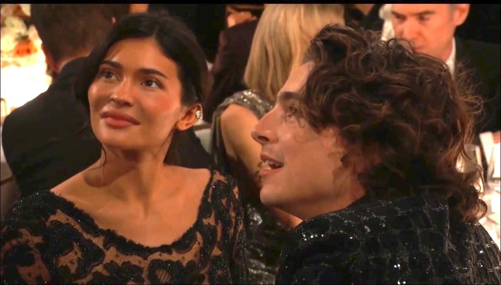 Timothee Chalamet and Kylie Jenner sit next to each other at the Golden Globes