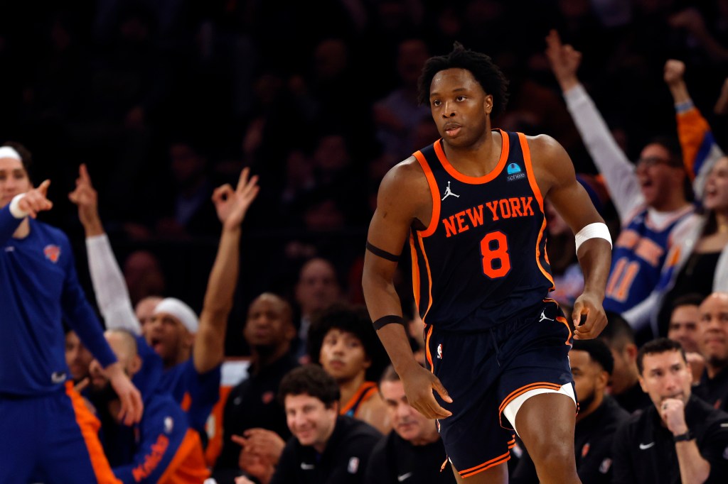 OG Anunoby of the New York Knicks scoring against the Denver Nuggets during a game at Madison Square Garden.