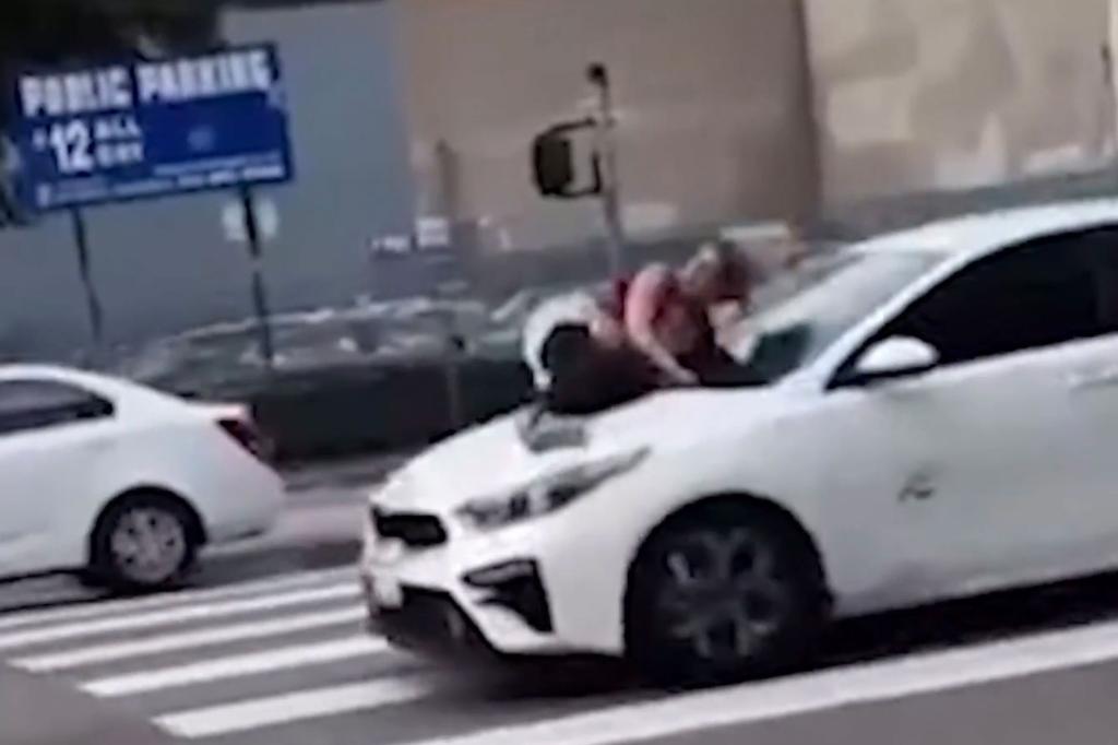 woman on car hood