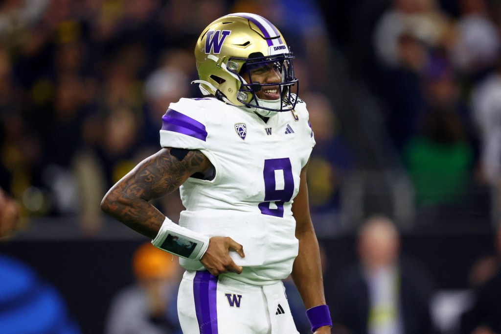 Washington Huskies quarterback Michael Penix Jr. (9) reacts after a play against the Michigan Wolverines during the fourth quarter