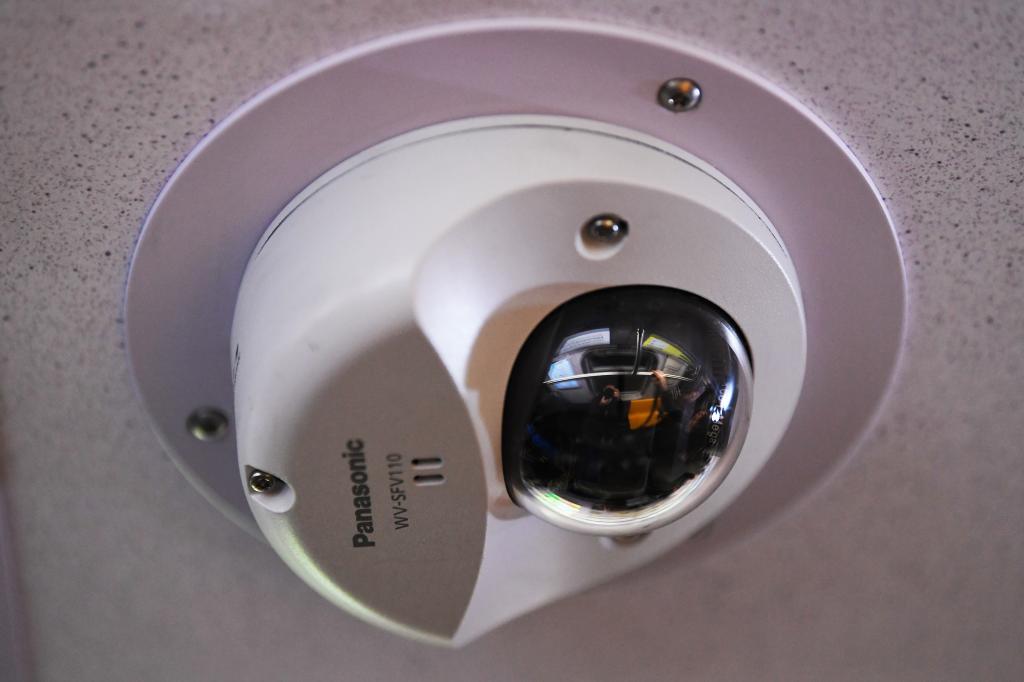 A security camera mounted to the ceiling. 