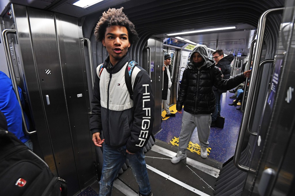 A young man walks through the open gangway.