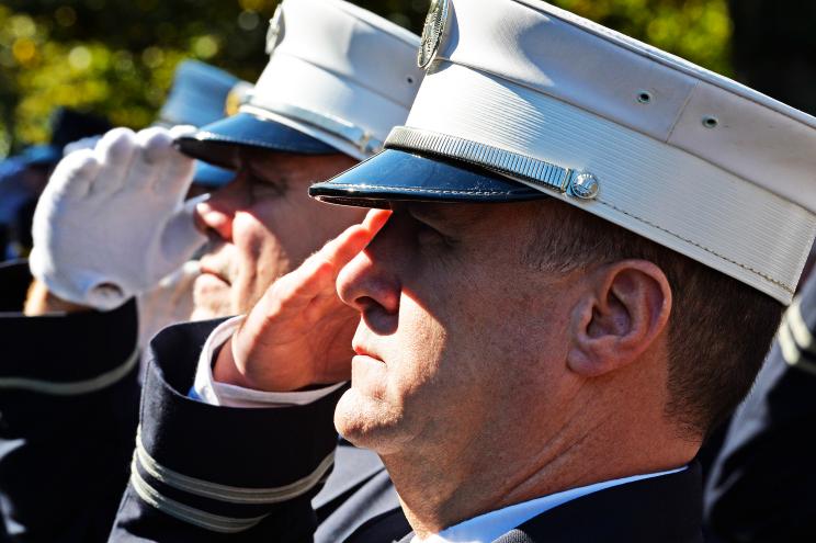 FDNY chiefs in formal uniform white hats saluting