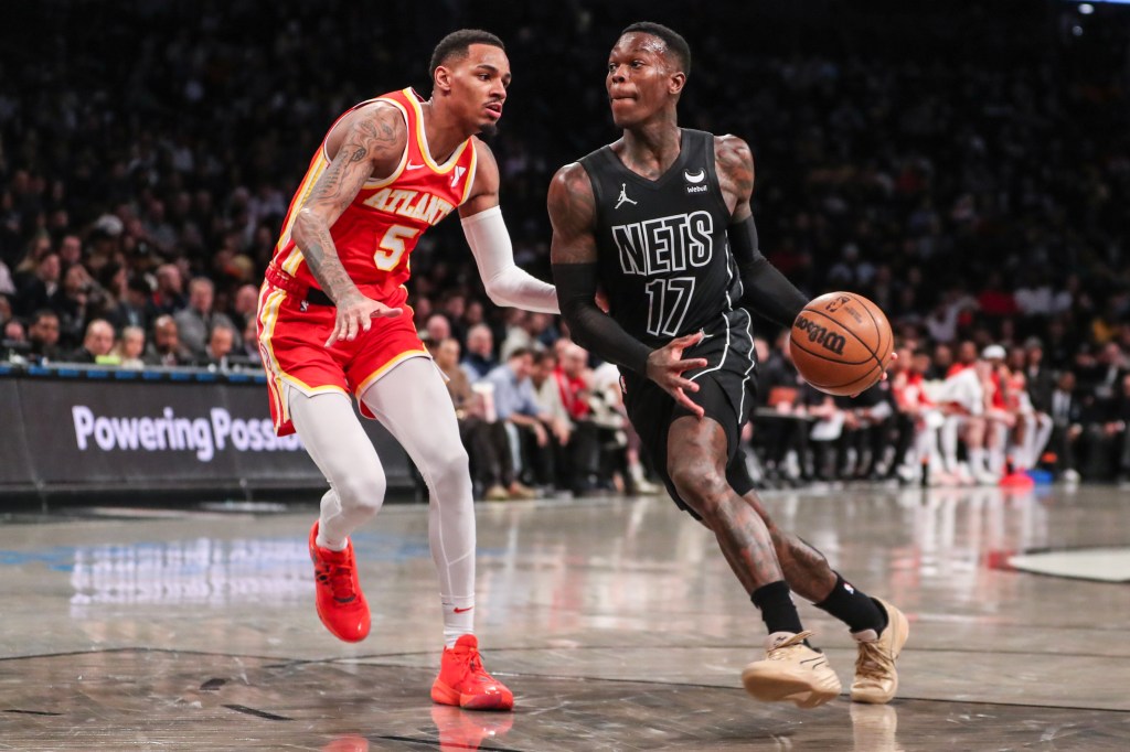 Nets guard Dennis Schroder (17) looks to drive past Atlanta Hawks guard Dejounte Murray (5) in the second quarter at Barclays Center.