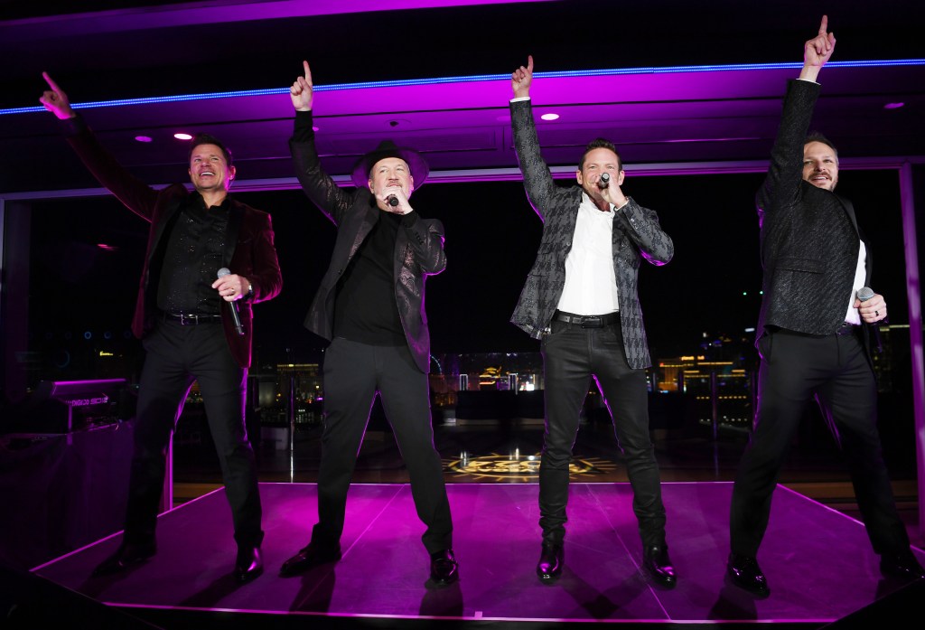 LAS VEGAS, NEVADA - DECEMBER 15: In this image released on December 31, Nick Lachey, Justin Jeffre, Jeff Timmons and Drew Lachey of 98 Degrees perform at Ghost Bar as part of the Nexstar "Las Vegas Countdown to 2024" on December 15, 2023 in Las Vegas, Nevada. (Photo by Denise Truscello/Getty Images for Palms Casino Resort)
