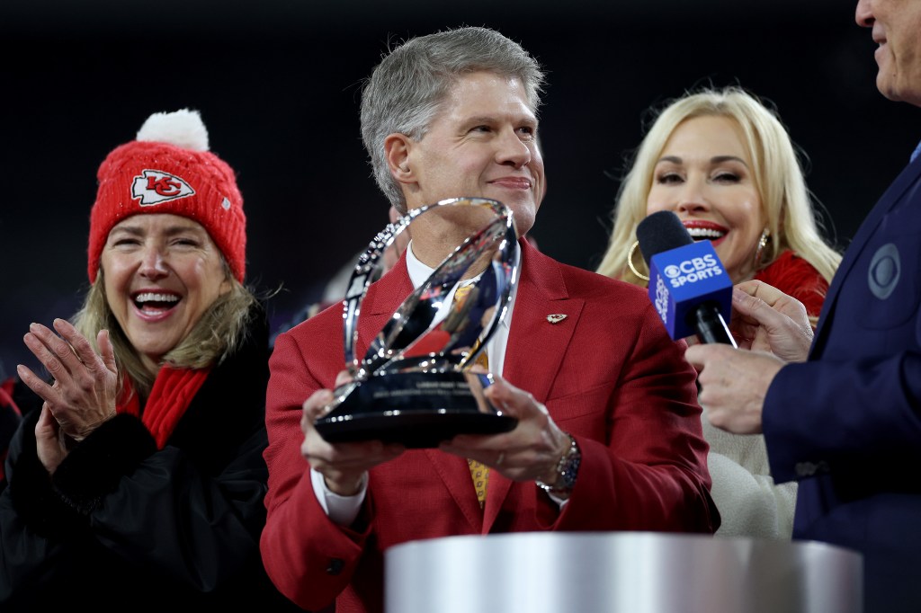 Clark Hunt holding the Lamar Hunt Trophy after beating the Baltimore Ravens in AFC Championship Game at M&T Bank Stadium in Baltimore, Maryland.