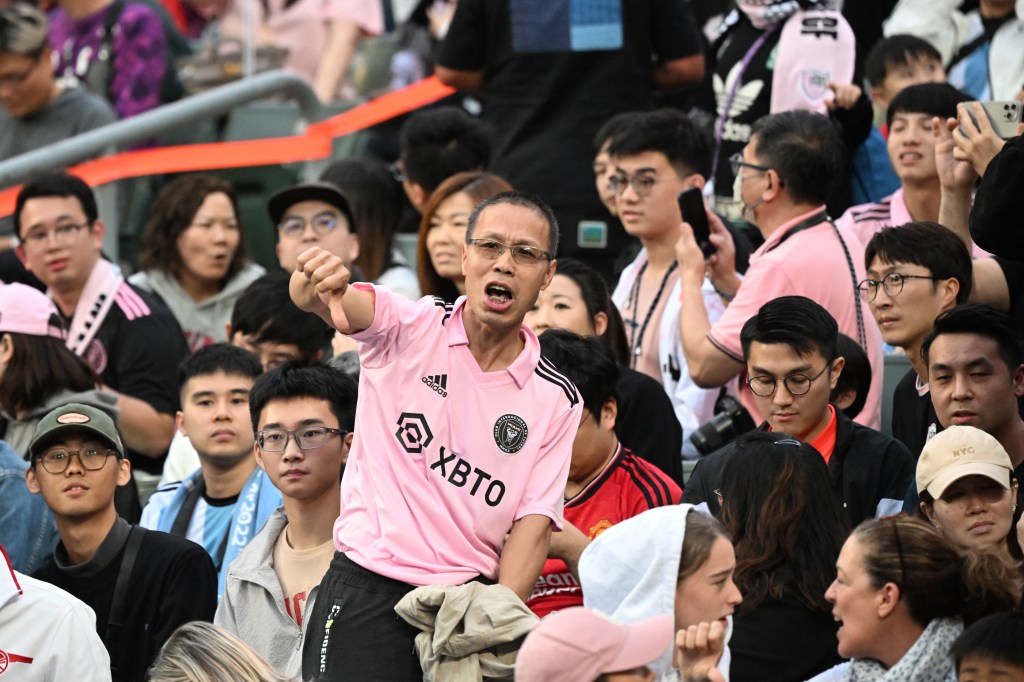 Fans react after not seeing Lionel Messi play after the friendly football match between Hong Kong XI and US Inter Miami CF in Hong Kong on Feb. 4, 2024. 