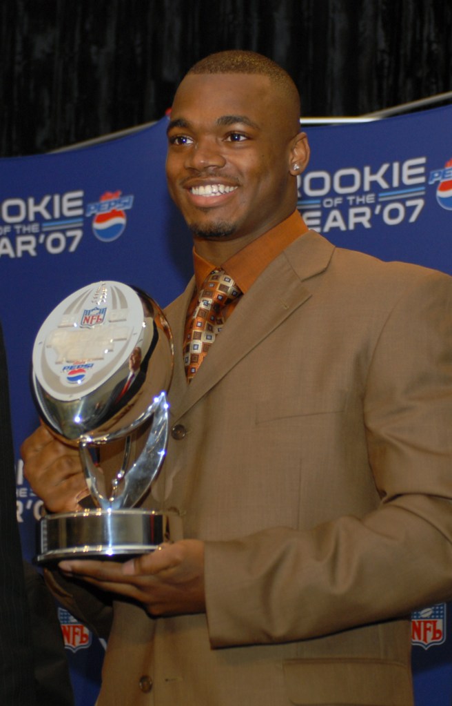 Vikings running back Adrian Peterson poses for photographs after he was named the 2007 NFL Rookie of the Year.