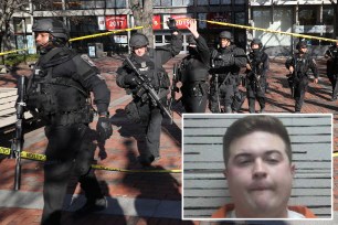 Law enforcement officials, and SWAT team members, respond to a threat on the campus of Boston University at 771 Commonwealth Ave., in Boston on Nov. 18, 2016.