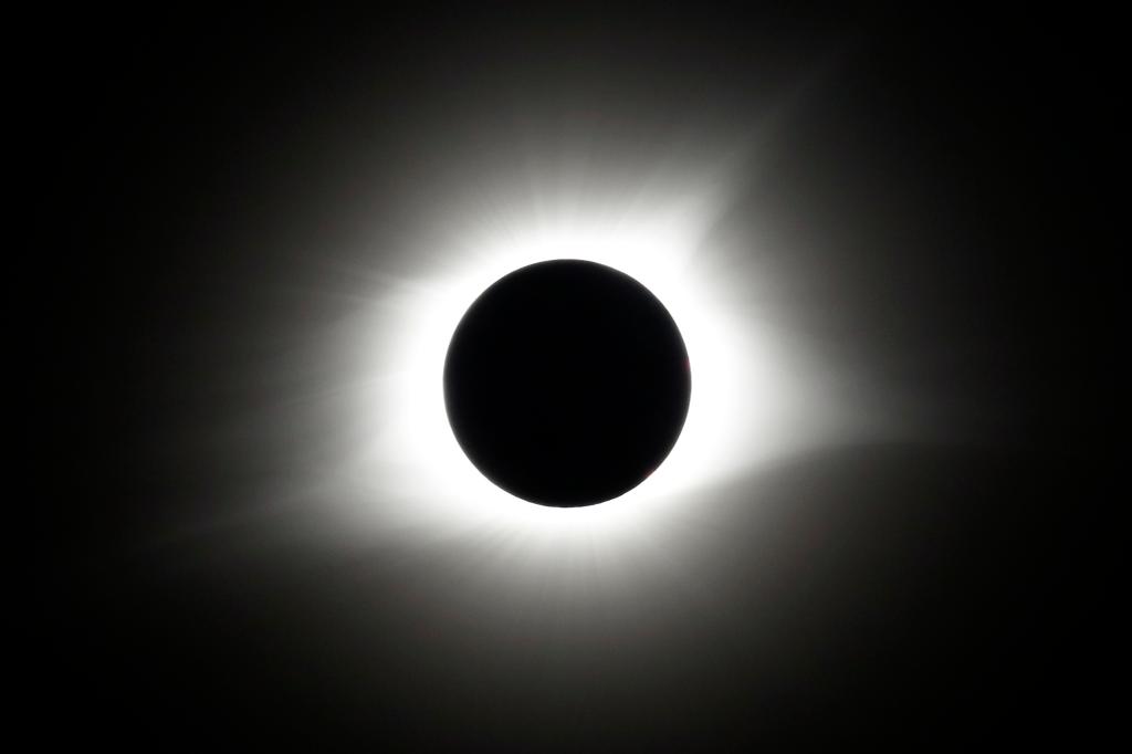 This is what a total eclipse looks like: a black orb with the shone of the sun around it