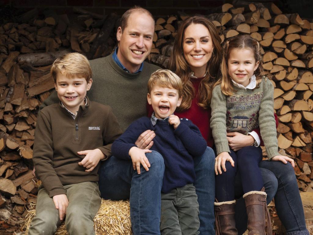 Prince William, Kate Middleton, Prince George, Princess Charlotte and Prince Louis pose for a family Christmas card photo in front of a tree at Anmer Hall.