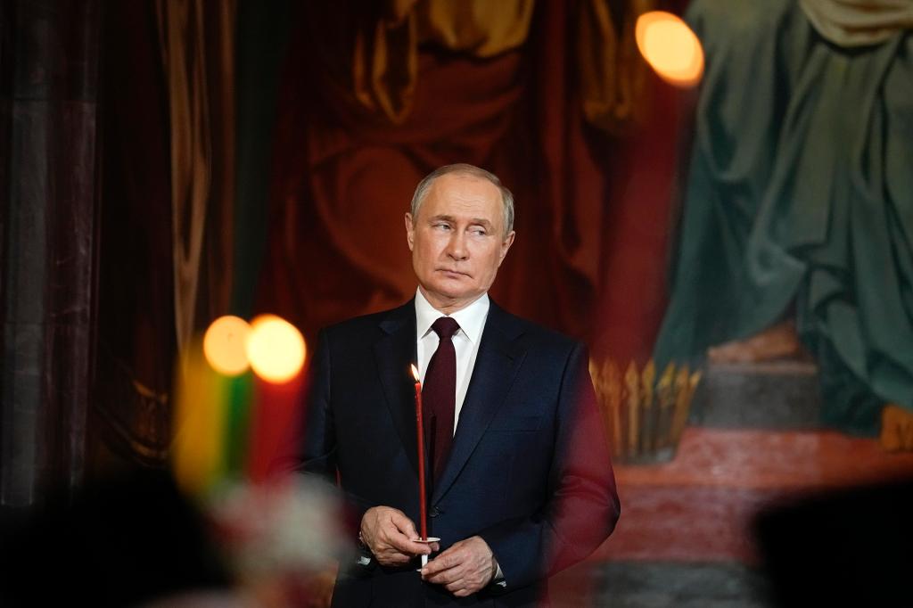 Russian President Vladimir Putin attends the Orthodox Easter service in the Christ the Savior Cathedral in Moscow, Russia, Sunday, April 24, 2022