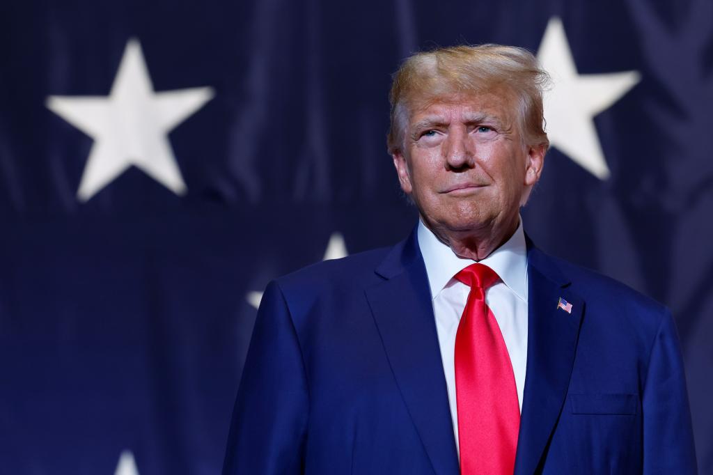 Former President Donald Trump in a suit delivering remarks during Georgia State GOP Convention at Columbus Convention and Trade Center.