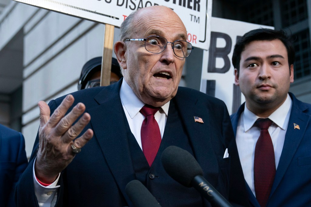 FILE - Former New York Mayor Rudy Giuliani speaks during a news conference outside the federal courthouse in Washington, Friday, Dec. 15, 2023.