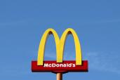 A McDonald's sign in Sint-Pieters-Leeuw, Belgium, with yellow and red colors and white text, in a file photo by REUTERS/Yves Herman.