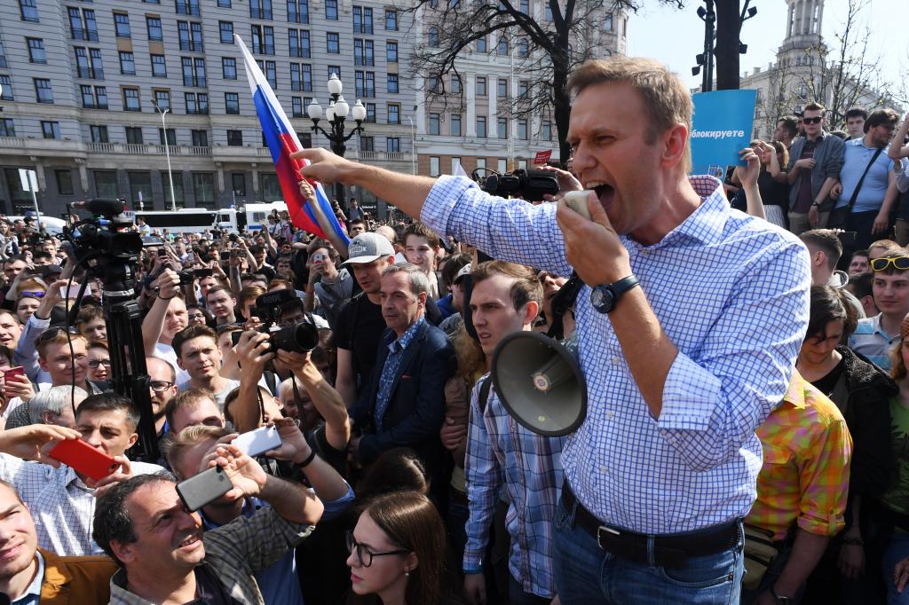 Russian opposition leader Alexei Navalny addresses supporters during an unauthorized anti-Putin rally on May 5, 2018 in Moscow