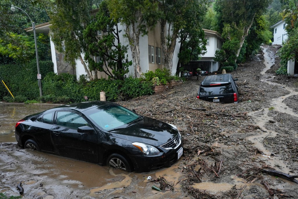 Vehicles are damaged by a mudslide