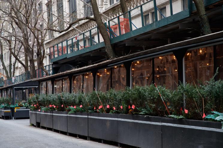 Outdoor dining shed, with planted greenery at Leopard at Des Artistes