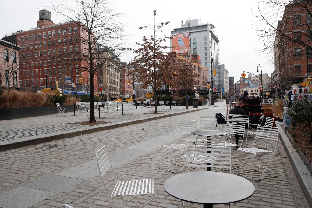 Tables along a cobblestone street