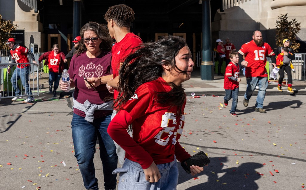 Chiefs fans flee after shots were fired during the Chiefs Super Bowl parade on Wednesday.