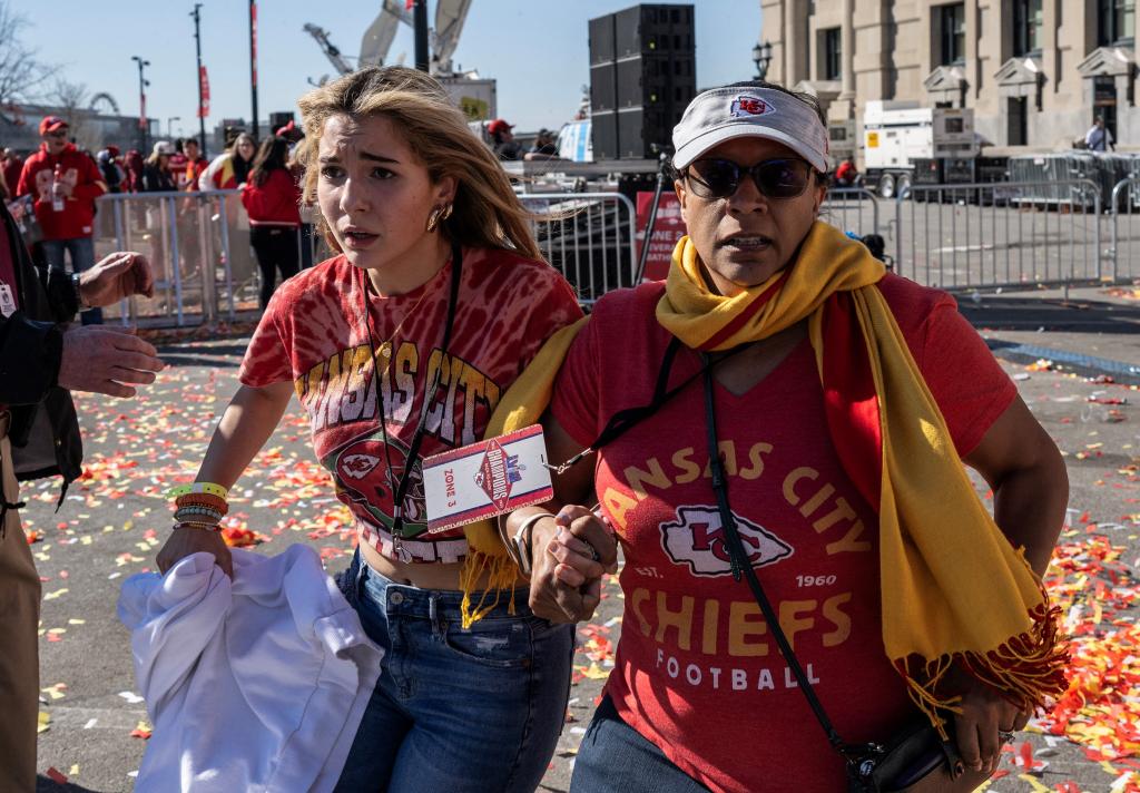 People flee after shots were fired near the Kansas City Chiefs' Super Bowl LVIII victory parade on February 14, 2024.