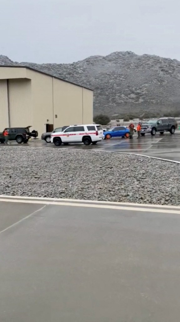 Rescue crews assist with search efforts for a U.S. Marine Corps helicopter with five crew members aboard that went missing overnight, in southeast of Pine Valley, San Diego, California, U.S., February 7, 2024, in this screen grab taken from a social media video. 