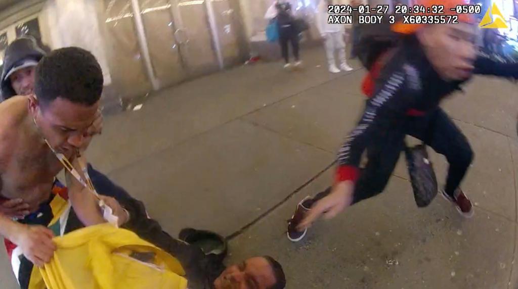 A cop's bodycam footage shows an alleged mob of migrants attacking officers.