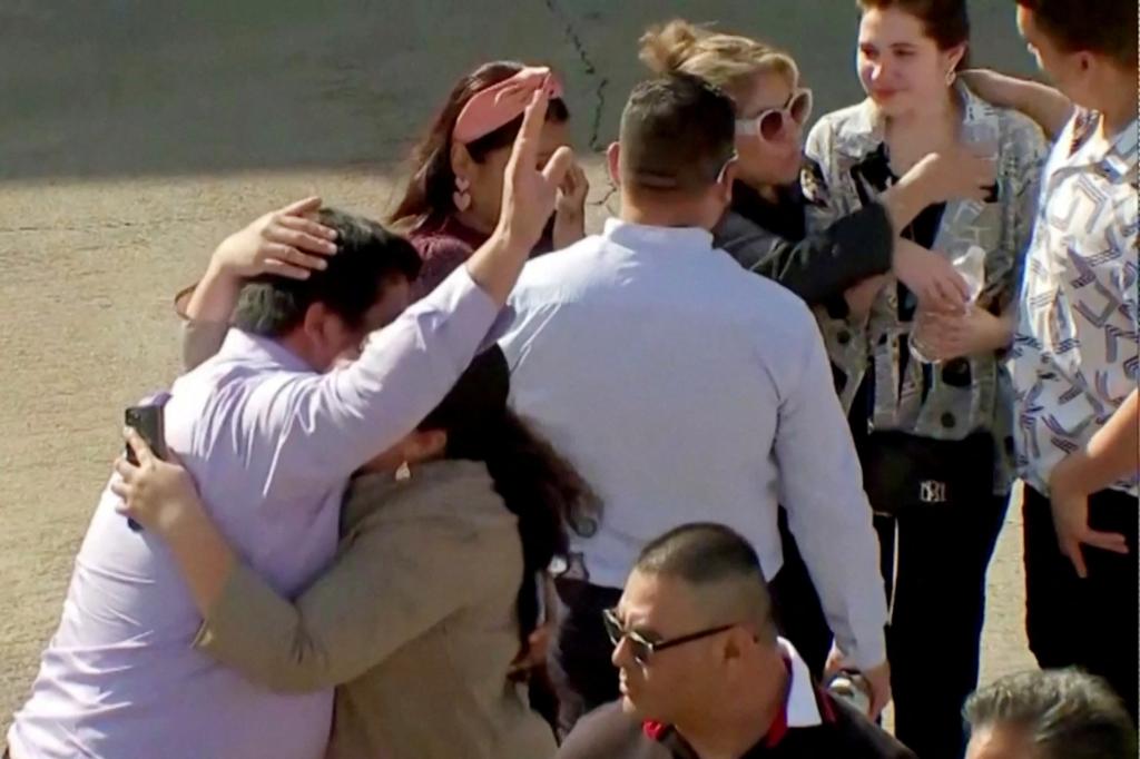 Evacuated parishoners react outside television evangelist Joel Osteen's Lakewood Church after the shooting incident in Houston, Texas.