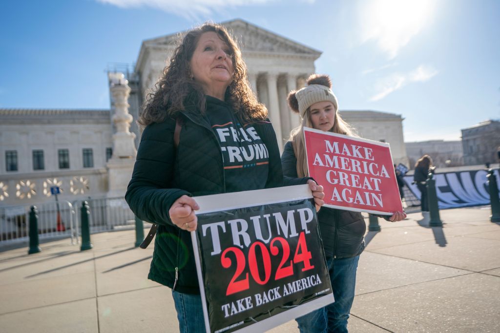 Supporters of former President Donald J. Trump in front of the Supreme Court as justices hear arguments in Trump v Anderson in Washington, DC, USA, 08 February 2024. 