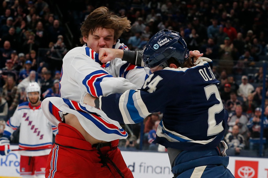 Mathieu Olivier and Matthew Rempe in a fight during a hockey game between New York Rangers and Columbus Blue Jackets on Feb 25, 2024.